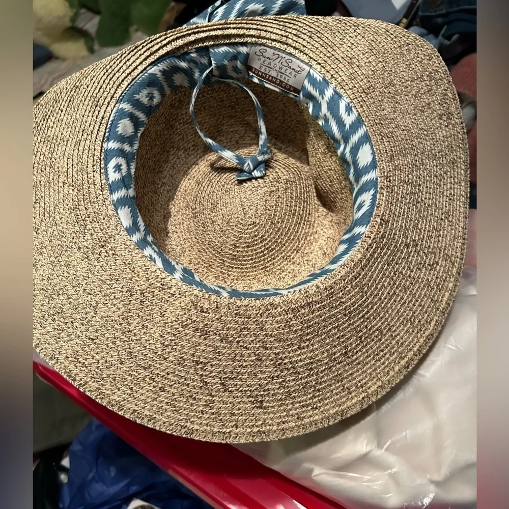 Brand: Sun n’ Sand Size: One size Color: Brown with blue and white bow